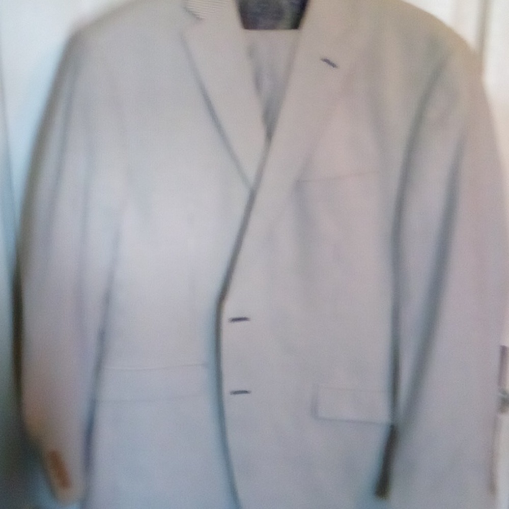 2 piece searsucker worn once in DR for night wedding for 40 minutes. 42R